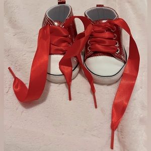 Red sparkle baby shoe with added red satin laces
